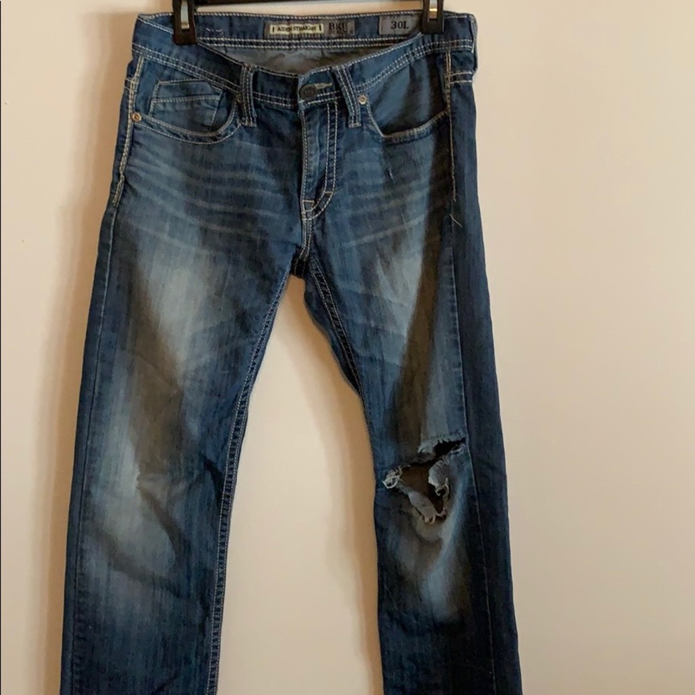 BKE jeans with a ripped knee